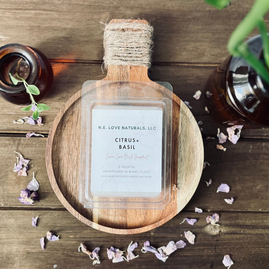 N.E. Love Naturals, LLC product on a wooden tray with dried flowers on a wooden surface